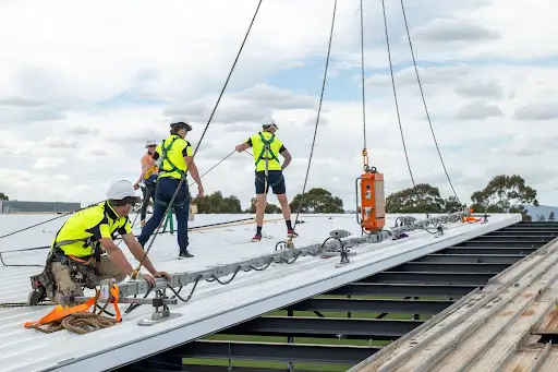 roof and render sa team during a commercial roofing process in alberton oval
