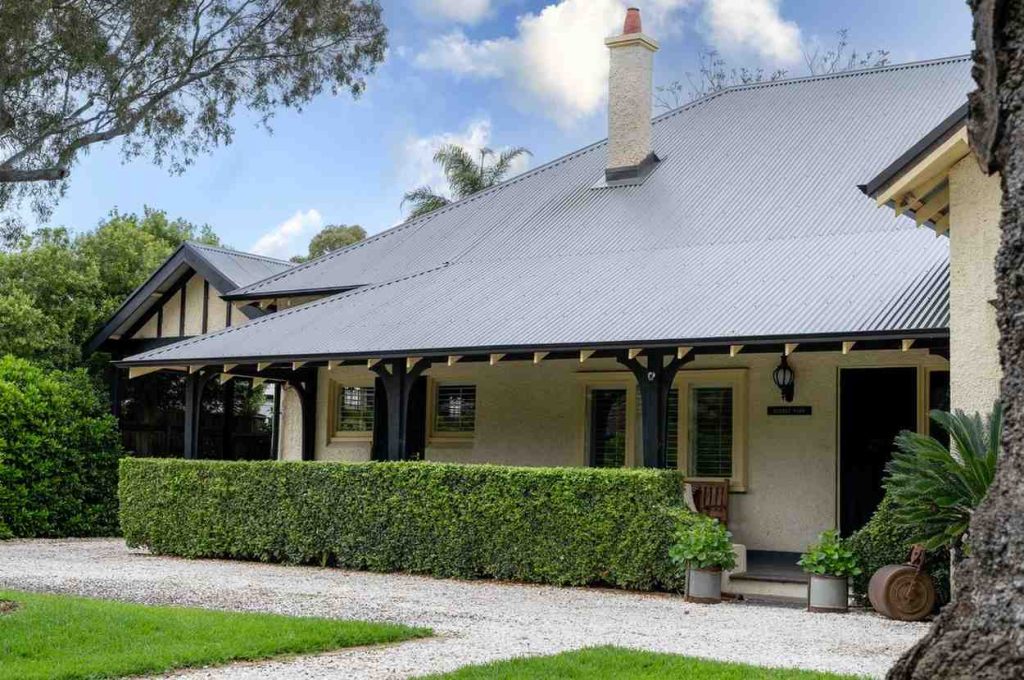 Heritage home with new grey metal roof replacement and front verandah